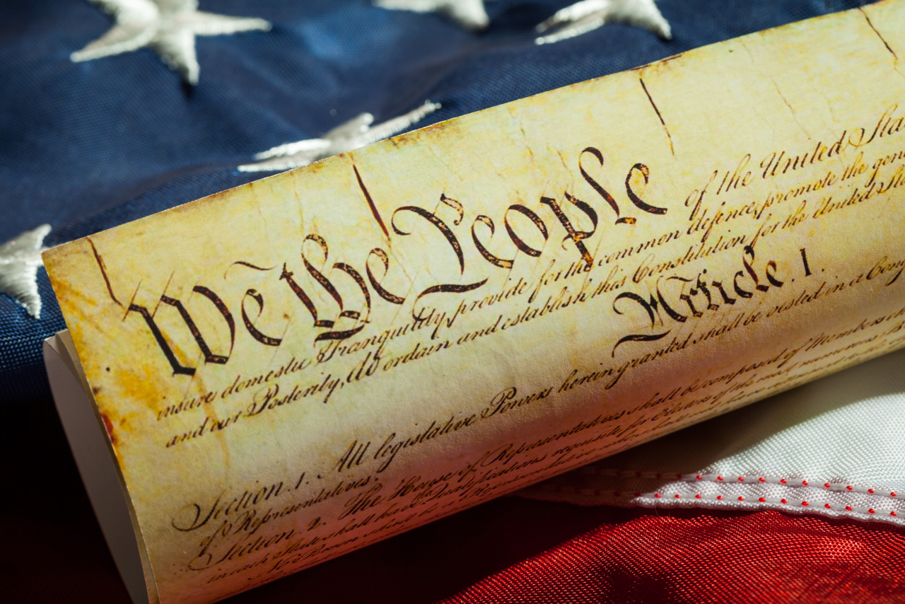 the declaration of independence with an american flag in the background