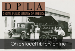 black and photo of mobile library with two girls standing beside it